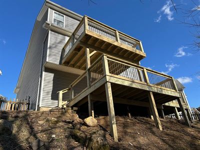 Two-level treated wood deck on a sloped lot in Fern Creek KY