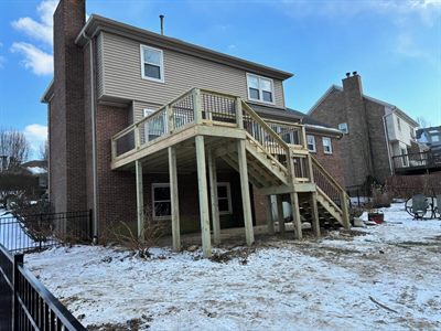 Elevated deck with long stair run on a brick two-story home in Fern Creek KY