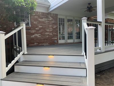 Composite stairs with lighted risers on a Crestwood porch deck